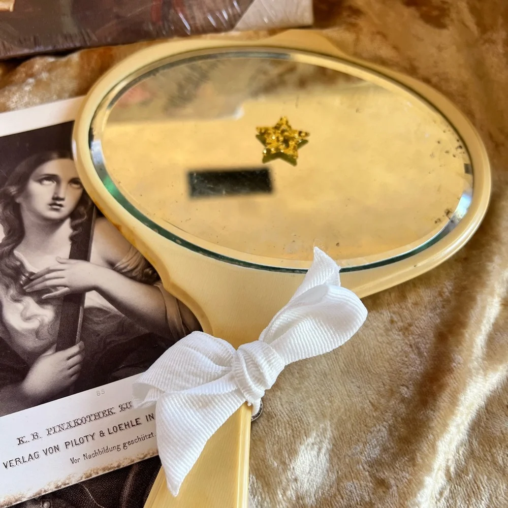 Vintage Celluloid Beveled Handheld Mirror with White Bow